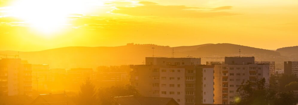 bright sun over a city